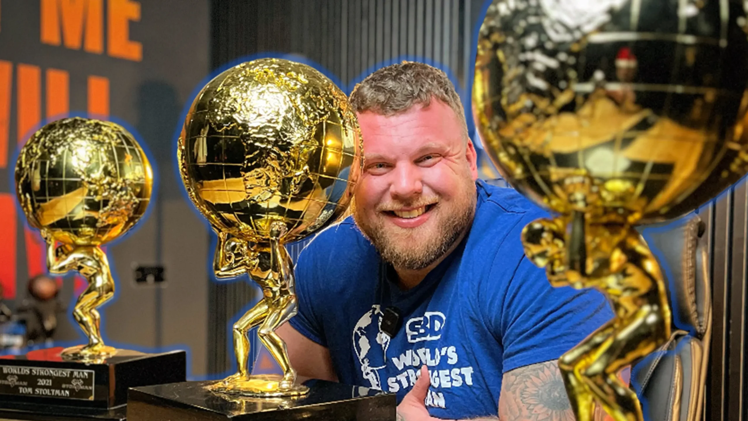 Tom Stoltman, an autistic sportsman, poses next to three World's Strongest Man tropies.